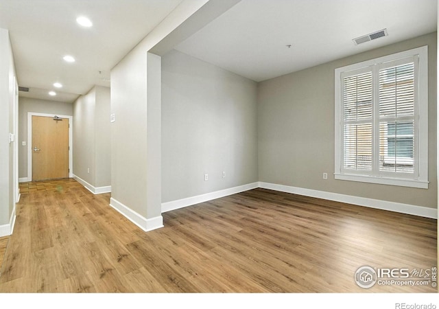1631 N Emerson St Unit 207, Denver, CO 80218 - unfurnished room with light wood-style flooring and recessed lighting