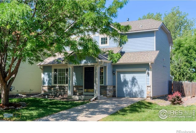 6126 Shamrock Cir, Frederick, CO 80530 - view of front of property with concrete driveway, roof with shingles, stone siding, and a garage