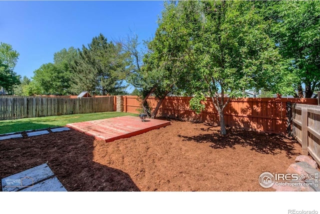 6126 Shamrock Cir, Frederick, CO 80530 - fenced backyard with a deck