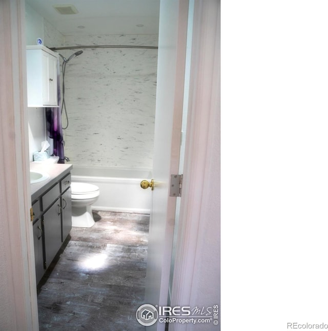 4616 Homestead Ct, Greeley, CO 80634 - bathroom with vanity, wood finished floors, and  shower combination