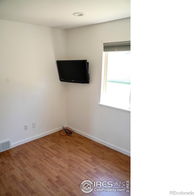 4616 Homestead Ct, Greeley, CO 80634 - empty room with wood finished floors and baseboards
