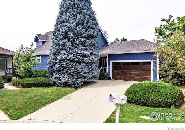 147 Keystone Trl, Broomfield, CO 80020 - view of front of property featuring a garage, concrete driveway, and a front yard