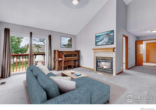 147 Keystone Trl, Broomfield, CO 80020 - living room with carpet floors, a fireplace, high vaulted ceiling, ceiling fan, and a textured ceiling