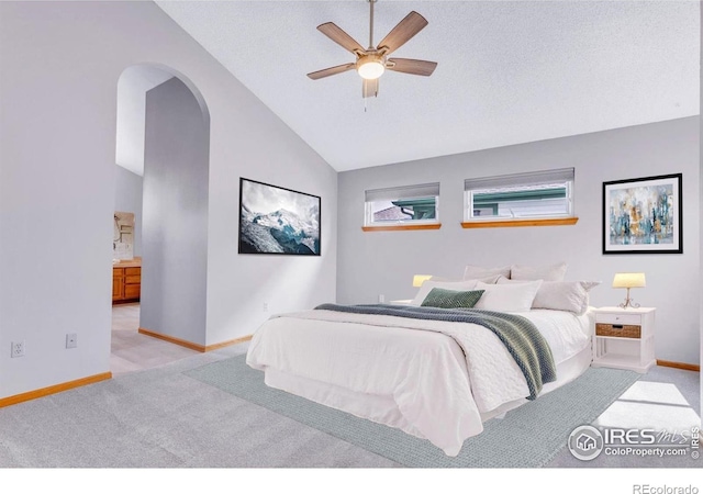 147 Keystone Trl, Broomfield, CO 80020 - carpeted bedroom with arched walkways, vaulted ceiling, and ceiling fan