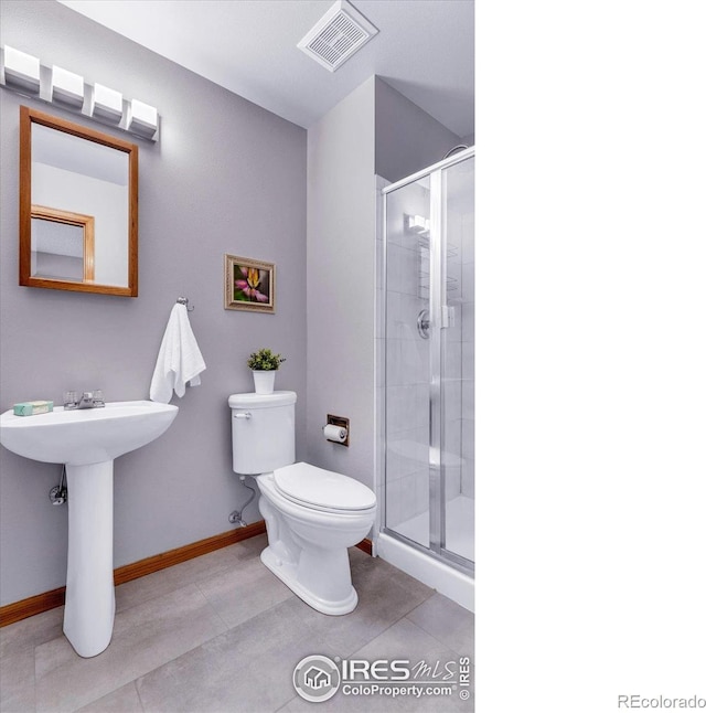 147 Keystone Trl, Broomfield, CO 80020 - bathroom featuring a stall shower and tile patterned flooring