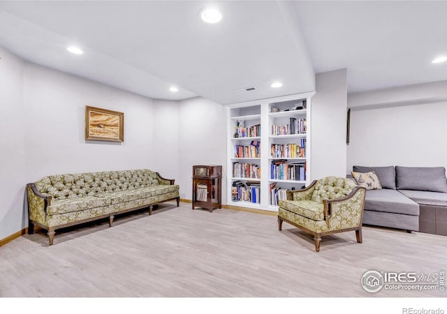 147 Keystone Trl, Broomfield, CO 80020 - living room featuring wood finished floors, recessed lighting, and built in features