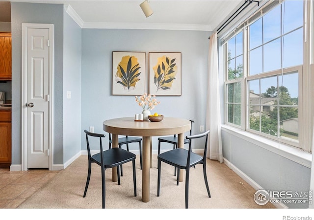5620 Fossil Creek Pkwy Unit 6303, Fort Collins, CO 80525 - dining space featuring crown molding and light carpet