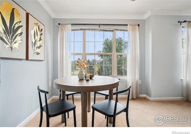 5620 Fossil Creek Pkwy Unit 6303, Fort Collins, CO 80525 - dining area featuring crown molding and light colored carpet