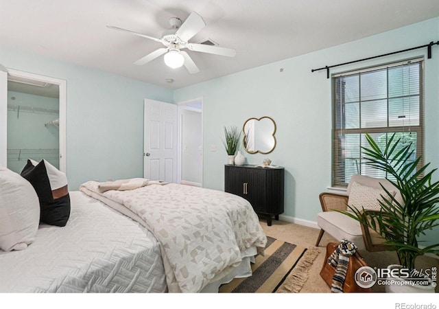 5620 Fossil Creek Pkwy Unit 6303, Fort Collins, CO 80525 - bedroom with light colored carpet, ceiling fan, and a spacious closet