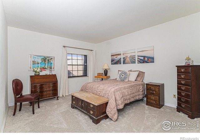 7250 Eastmoor Dr, Denver, CO 80237 - bedroom featuring light colored carpet and baseboards
