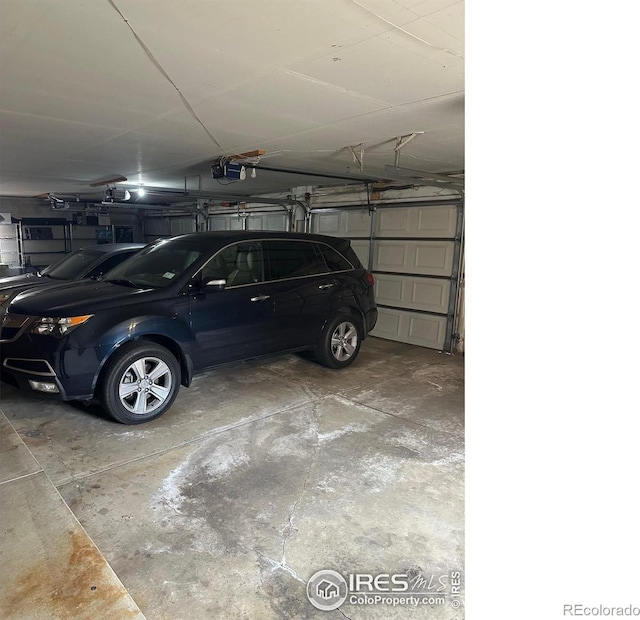 7250 Eastmoor Dr, Denver, CO 80237 - garage featuring a garage door opener