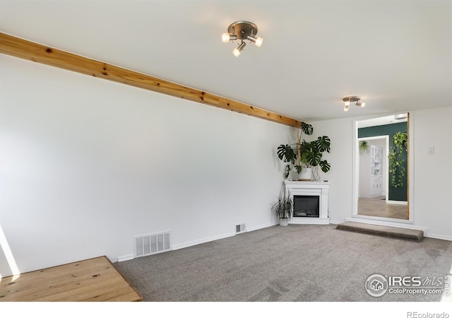 7850 Raleigh Pl, Westminster, CO 80030 - unfurnished living room featuring a fireplace and carpet floors