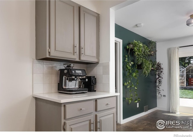 7850 Raleigh Pl, Westminster, CO 80030 - kitchen featuring gray cabinetry, decorative backsplash, and light countertops