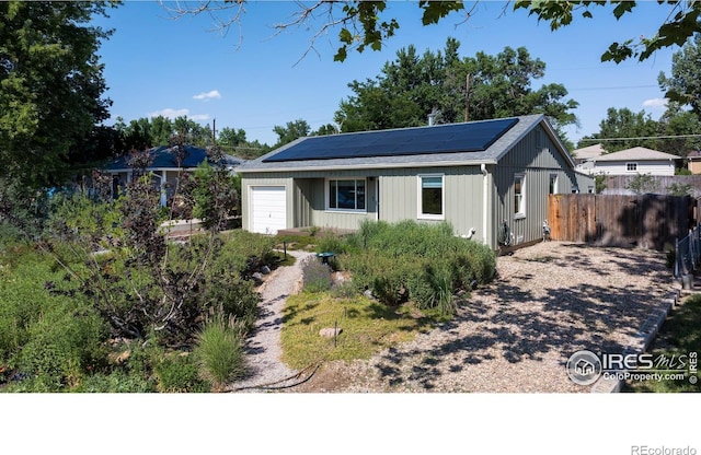 7850 Raleigh Pl, Westminster, CO 80030 - view of front of house featuring solar panels and a garage
