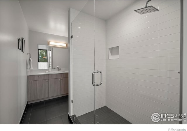 2718 Pine St Unit 301, Boulder, CO 80302 - bathroom featuring a shower stall, vanity, and tile patterned flooring