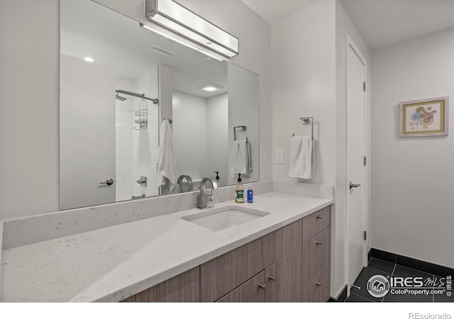 2718 Pine St Unit 301, Boulder, CO 80302 - bathroom featuring vanity, tile patterned flooring, and a shower