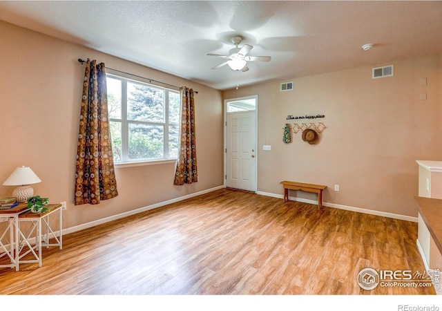 2131 Grays Peak Dr Unit 102, Loveland, CO 80538 - spare room with ceiling fan and wood finished floors
