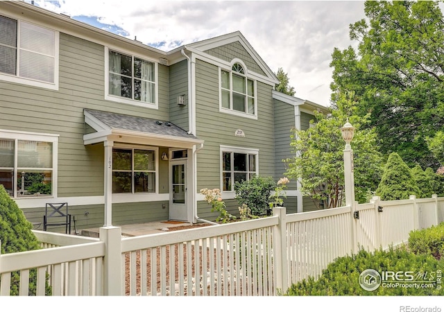 2131 Grays Peak Dr Unit 102, Loveland, CO 80538 - view of front of home with a shingled roof