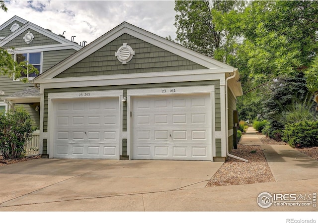 2131 Grays Peak Dr Unit 102, Loveland, CO 80538 - garage with concrete driveway