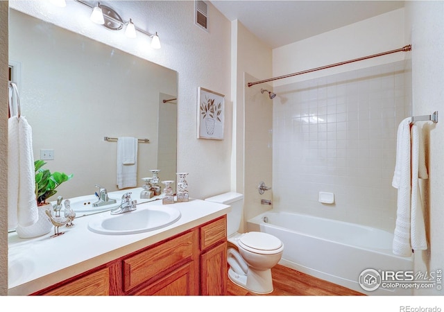2131 Grays Peak Dr Unit 102, Loveland, CO 80538 - bathroom with vanity, bathtub / shower combination, and wood finished floors