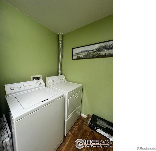 2131 Grays Peak Dr Unit 102, Loveland, CO 80538 - washroom featuring washer and clothes dryer and dark wood finished floors