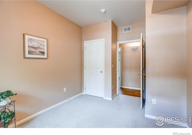 2131 Grays Peak Dr Unit 102, Loveland, CO 80538 - unfurnished bedroom with carpet floors and baseboards