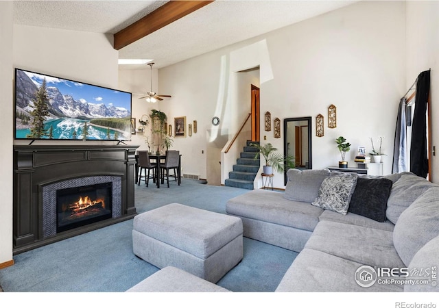 1200-1202 Parker Dr, Longmont, CO 80501 - living room with carpet floors, stairway, beamed ceiling, ceiling fan, and high vaulted ceiling