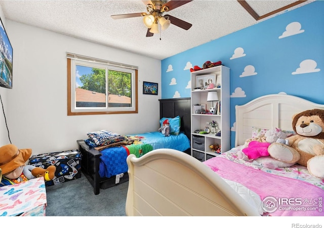 1200-1202 Parker Dr, Longmont, CO 80501 - carpeted bedroom with a textured ceiling and ceiling fan