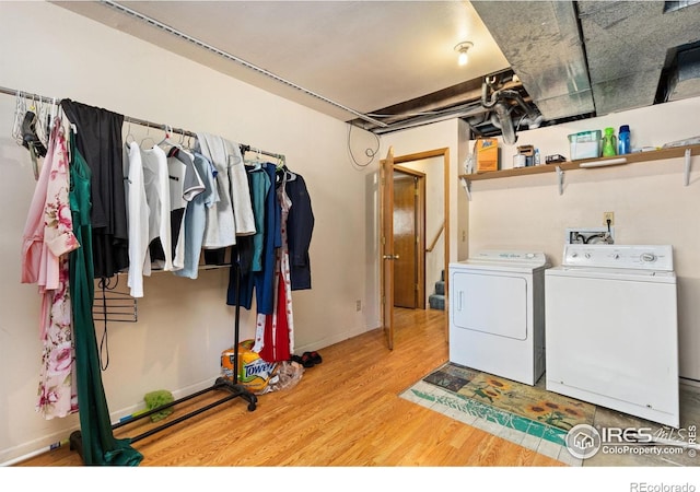 1200-1202 Parker Dr, Longmont, CO 80501 - laundry room featuring washing machine and dryer and wood finished floors