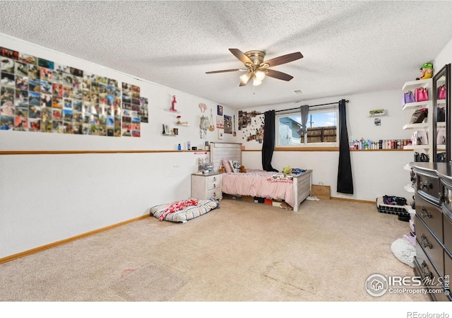 1200-1202 Parker Dr, Longmont, CO 80501 - carpeted bedroom with a textured ceiling and a ceiling fan
