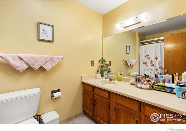 1200-1202 Parker Dr, Longmont, CO 80501 - full bathroom featuring toilet and vanity
