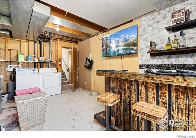 1200-1202 Parker Dr, Longmont, CO 80501 - unfinished basement featuring independent washer and dryer and a bar