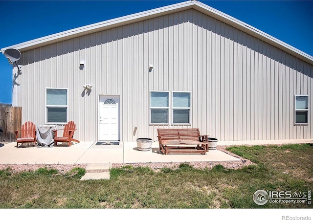 18441 Bandana Ln, Wellington, CO 80549 - back of house featuring a patio area and a lawn
