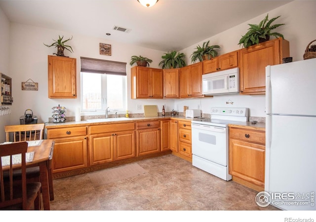 18441 Bandana Ln, Wellington, CO 80549 - kitchen featuring white appliances, light countertops, and light floors