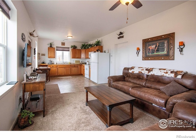 18441 Bandana Ln, Wellington, CO 80549 - living area featuring ceiling fan and carpet