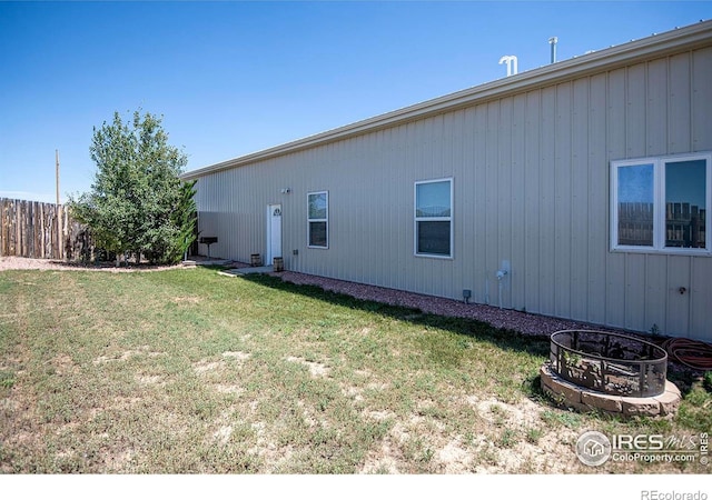 18441 Bandana Ln, Wellington, CO 80549 - view of side of property featuring an outdoor fire pit