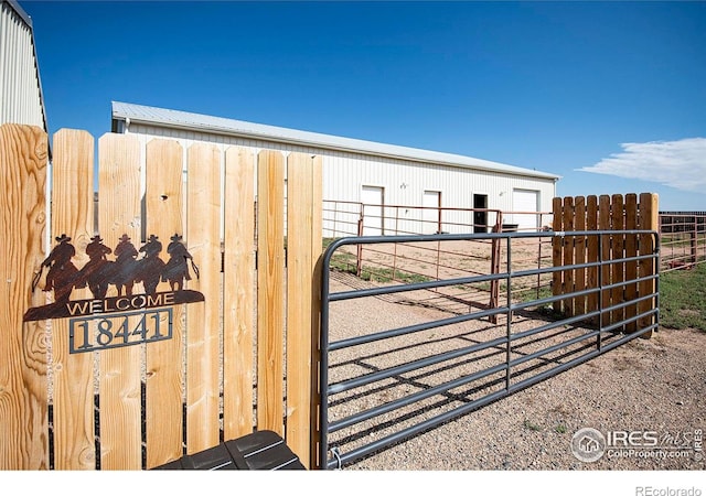 18441 Bandana Ln, Wellington, CO 80549 - gate with an exterior structure and an outdoor structure