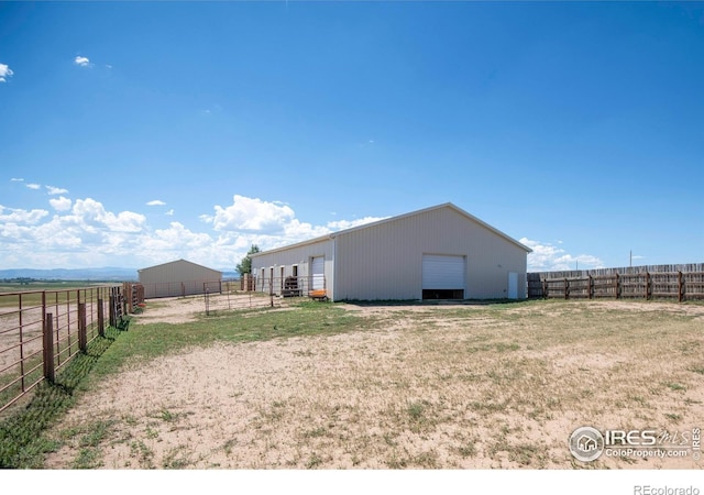 18441 Bandana Ln, Wellington, CO 80549 - view of yard with an outbuilding and a detached garage