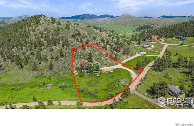 228 Mount Everest Dr, Livermore, CO 80536 - aerial overview of property's location with property boundaries highlighted and a mountainous background