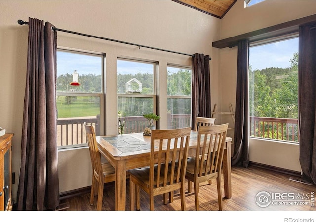 228 Mount Everest Dr, Livermore, CO 80536 - dining room featuring lofted ceiling and light wood-style flooring