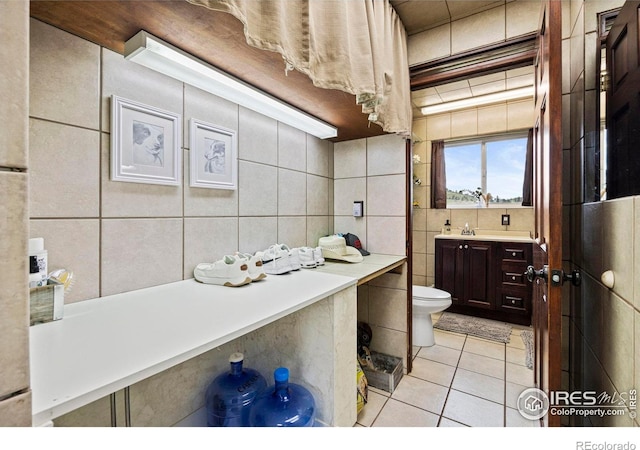228 Mount Everest Dr, Livermore, CO 80536 - bathroom featuring tile walls, tile patterned floors, and vanity