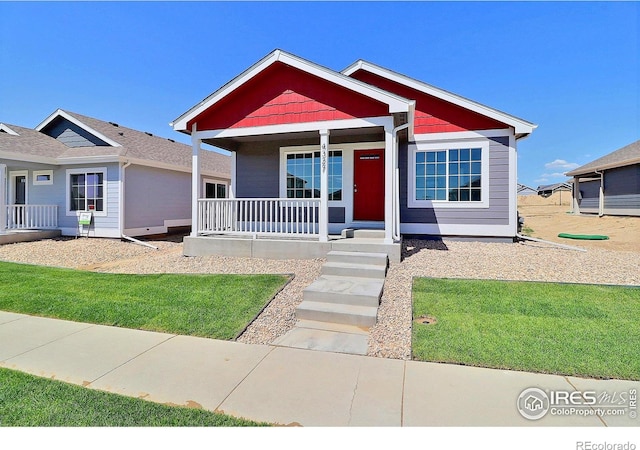 4327 Primrose Ln, Evans, CO 80620 - view of front of home with covered porch
