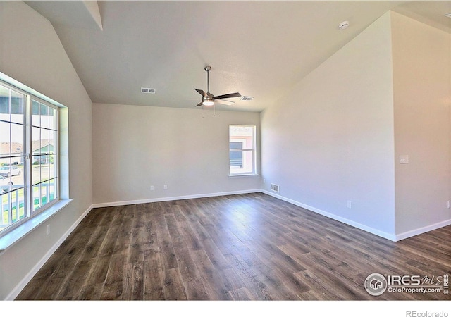 4327 Primrose Ln, Evans, CO 80620 - spare room featuring vaulted ceiling, a ceiling fan, healthy amount of natural light, and dark wood finished floors