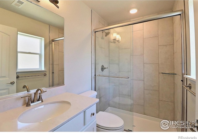 4327 Primrose Ln, Evans, CO 80620 - full bathroom with a stall shower, vanity, and recessed lighting