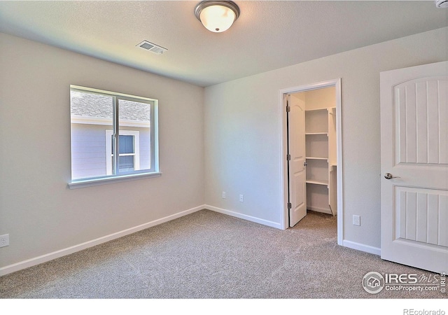 4327 Primrose Ln, Evans, CO 80620 - unfurnished bedroom featuring carpet and a spacious closet