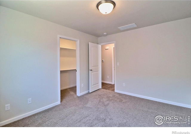 4327 Primrose Ln, Evans, CO 80620 - unfurnished bedroom with carpet flooring and a walk in closet