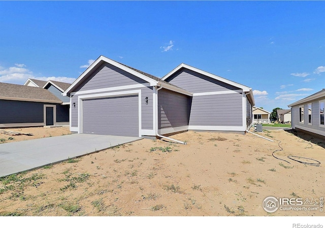 4327 Primrose Ln, Evans, CO 80620 - ranch-style home with a garage and concrete driveway