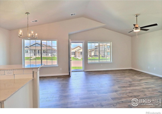 4327 Primrose Ln, Evans, CO 80620 - unfurnished living room featuring dark wood finished floors, lofted ceiling, a chandelier, and a ceiling fan