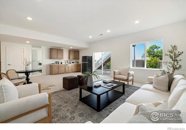 900 Eldorado Ln, Louisville, CO 80027 - carpeted living room with recessed lighting and a sink