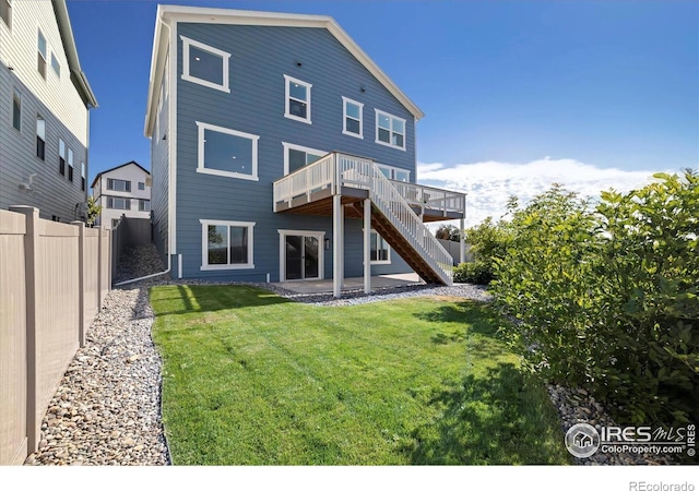 900 Eldorado Ln, Louisville, CO 80027 - back of property with stairway, a wooden deck, and a patio area